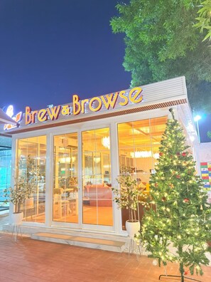 A storefront with a sign reading "Brew & Browse."