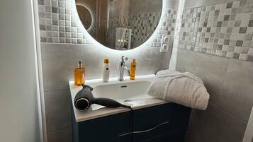 Shower, hair dryer, towels, soap