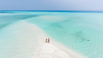 Beach nearby, white sand, beach towels