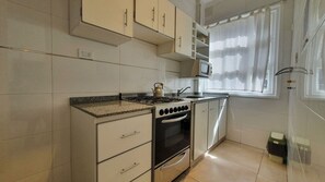 Fridge, microwave, oven, cookware/dishes/utensils