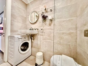Hair dryer, towels, soap, toilet paper