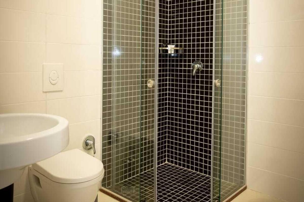 Shower, hair dryer, slippers, soap