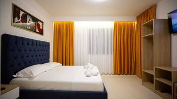 Double Room, City View | Desk, soundproofing, iron/ironing board, bed sheets