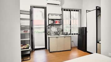 Luxury Studio Suite, Balcony, City View | Desk, blackout curtains, soundproofing, iron/ironing board
