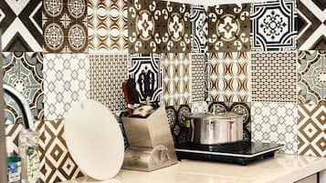 Fridge, electric kettle, cookware/dishes/utensils, dining tables