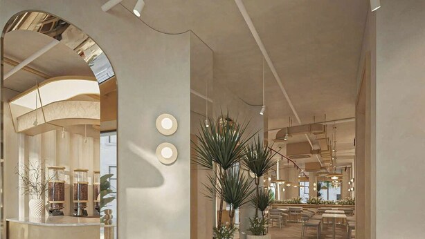 A spacious hotel lobby with a modern design, featuring a wooden herringbone floor, a reception desk, and several potted plants. - Eco Nest Hotel & Apartment (Hanoi)