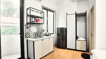 Luxury Studio Suite, Balcony, City View | Bathroom | Shower, hair dryer, slippers, towels