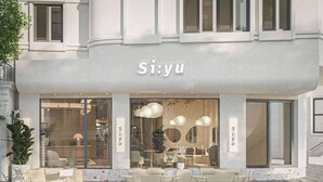 A modern storefront with the name 'Si:yu' prominently displayed. - Eco Nest Hotel & Apartment (Hanoi)