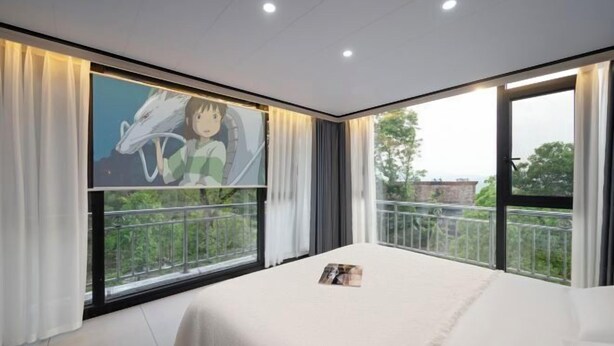 A modern hotel room with a large window, a bed, and a wall-mounted TV. - Wugong Mountain near Shuiya Residence (Luxi)
