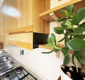 Fridge, oven, coffee/tea maker, cookware/dishes/utensils