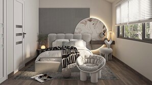 Une chambre à coucher moderne avec un lit, des tables de chevet, une chaise et une fenêtre.