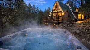 A cabin with a hot tub, surrounded by trees, and a wooden deck. - A-Frame On The Rocks. Hot Tub. Payson. Waterwheel. (Payson)
