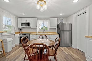 Fridge, microwave, oven, stovetop - Fisherman's Cottage | Cozy Island Retreat, Screened Porch, Walk to Town & Dog Friendly (Chincoteague Island)