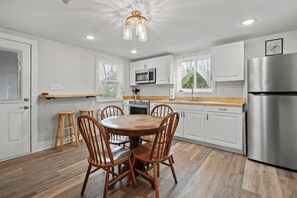 Fridge, microwave, oven, stovetop - Fisherman's Cottage | Cozy Island Retreat, Screened Porch, Walk to Town & Dog Friendly (Chincoteague Island)