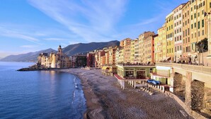 A coastal town with colorful buildings, a beach, and a prominent tower. - 1 bedroom pet friendly home in Avegno (Avegno)