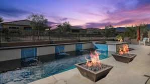 A swimming pool with a fire feature and a view of the surrounding neighborhood. - 2-bedroom house in superb Rancho Mirage Dell Webb 55+ Community. (Rancho Mirage)