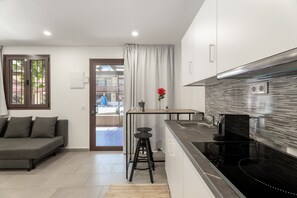 Fridge, microwave, stovetop, coffee/tea maker