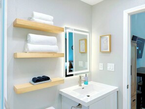 Shower, hair dryer, towels, soap