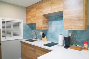 Fridge, microwave, stovetop, coffee/tea maker