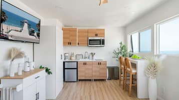 Microwave, stovetop, coffee/tea maker, cookware/dishes/utensils