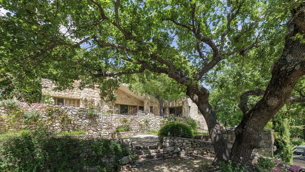 A stone building with a stone staircase leading to a wooden door. - Fabulous houses with breathtaking views in a peaceful and stunning environment (Suzette)