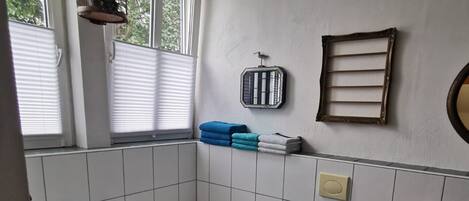 Hair dryer, towels, soap, toilet paper