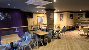 Dine in comfort at this restaurant with individual and group tables, a counter area, and a seating area with a view.