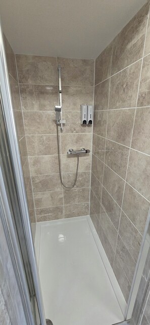 King Room | Bathroom | Shower, hair dryer, towels, soap