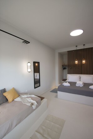 Junior Suite with Garden view and hot tub | Living area | 48-inch LED TV with satellite channels - Airy suites santorini (Santorini)