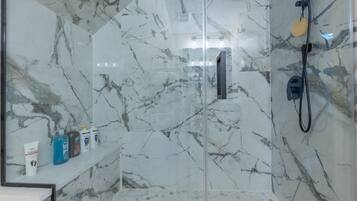 Shower, hair dryer, towels, soap