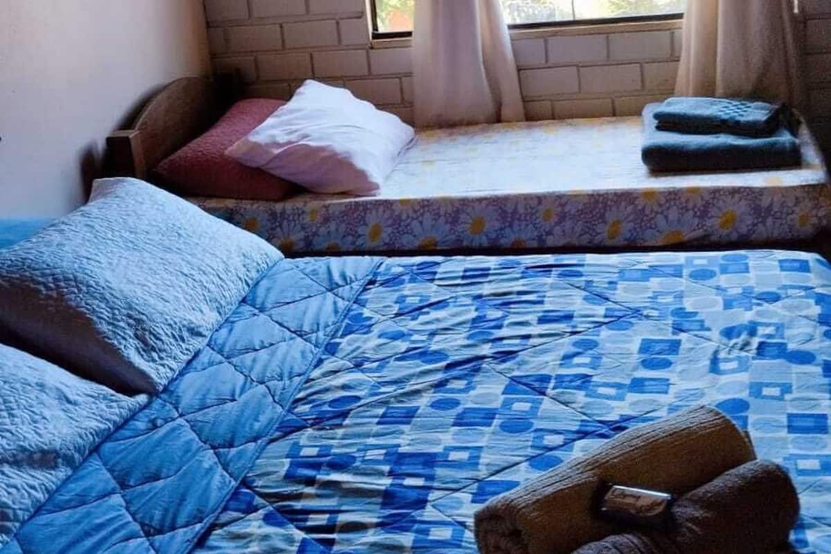 Standard Quadruple Room, Non Smoking, Pool View | Free WiFi, bed sheets