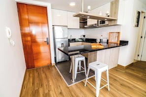Fridge, microwave, stovetop, coffee/tea maker