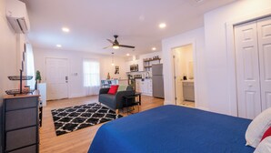 A compact living space with a bed, a sofa, a dining area, and a kitchenette. - Pet-Free Studio Rental on 2nd Floor w/ Parking (San Antonio)