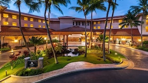 A resort with a central courtyard, palm trees, and a small waterfall. - OceanView Marriott Waiohai beach club 2BDRM villa , Full Resort Access  (Koloa)