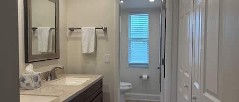 Shower, hair dryer, towels, soap