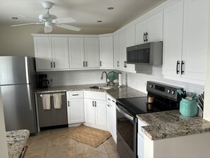 Fridge, microwave, oven, stovetop - Resort - Style Condo in Naples, Florida (Naples)