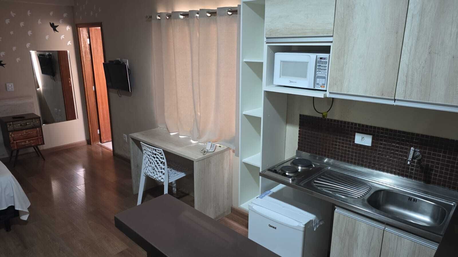 Mini-fridge, microwave, stovetop, cookware/dishes/utensils