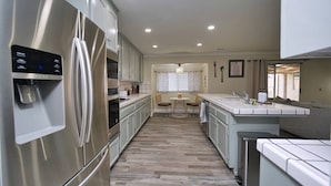 Coffee/tea maker, fridge, microwave, oven - Cozy Family Retreat: Coffee Bar, Game Room and Pet Friendly (Lodi)