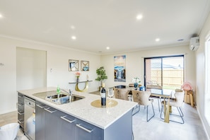 High chair - StayAU Charming 4BR Retreat Wyndham Vale (Wyndham Vale)