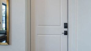 A white door with the word 'FOUR' above it, indicating a room number. - Beautiful Main Street Living in Trussville  (Trussville)