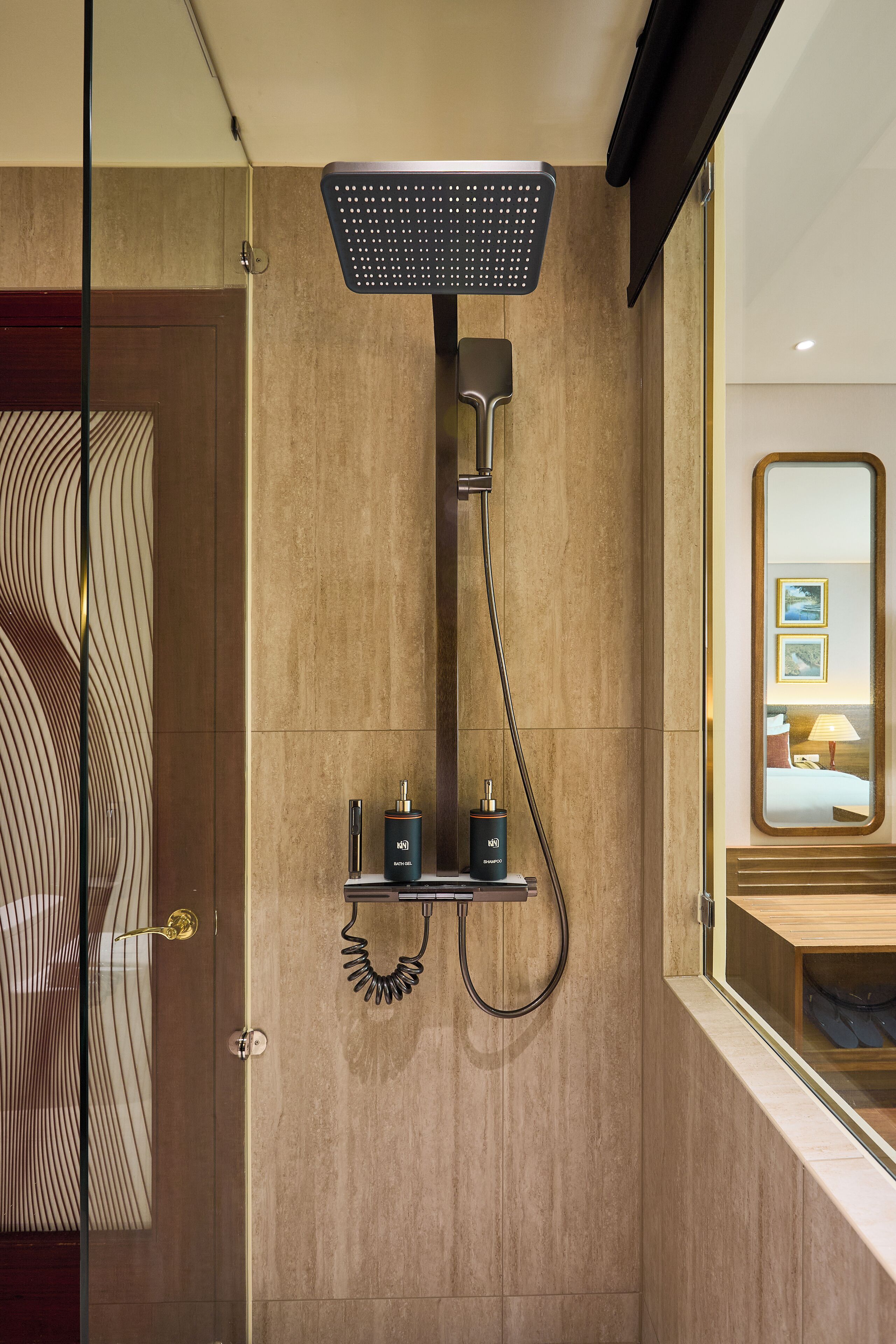 A modern bathroom with a shower, a vanity, and a mirror.