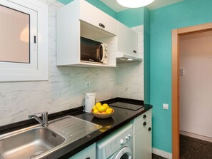 Fridge, microwave, cookware/dishes/utensils
