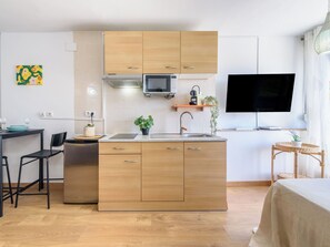 Fridge, microwave, cookware/dishes/utensils