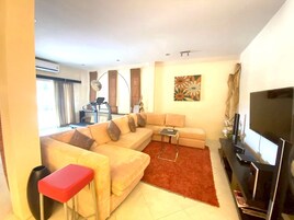 Villa, 4 Bedrooms, Private Pool, Beachfront | Living area | 50-inch LED TV with cable channels