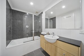 Shower, hair dryer, towels, shampoo