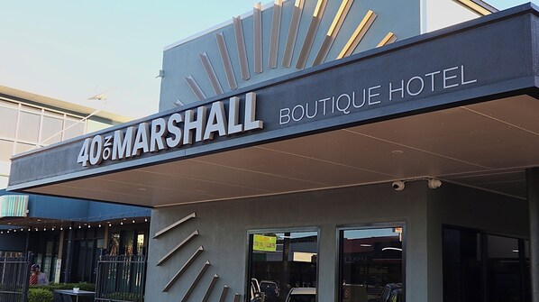 The exterior of 405 Marshall Boutique Hotel with a modern design and a prominent sign. - 40 on Marshall Street (Goondiwindi)