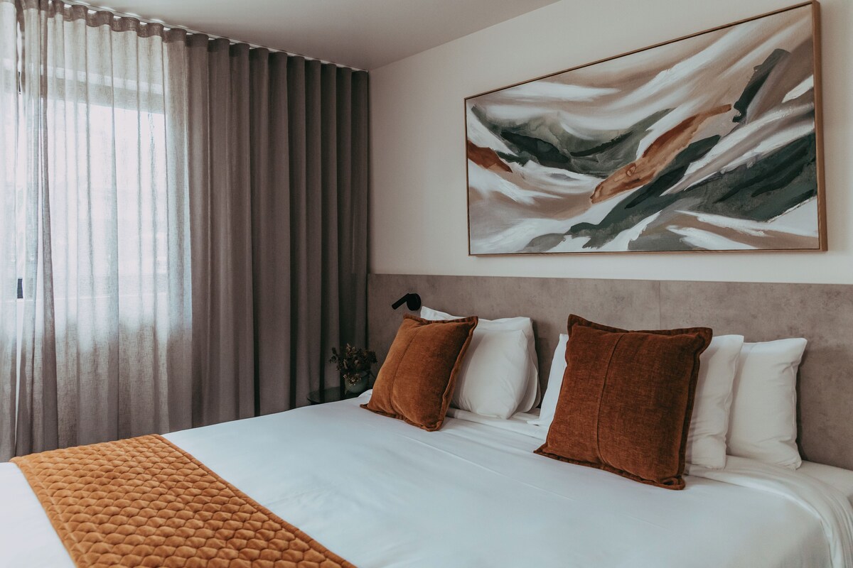 Premium bedding, pillowtop beds, desk, laptop workspace