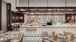 A modern restaurant with a long counter, multiple tables, and chairs. - WHITE SWAN HOTEL SHANTOU (Shantou)