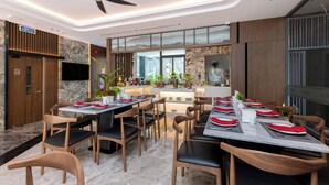 A modern dining area with wooden chairs and tables, a ceiling fan, and a view of the outdoors through large windows. - Stella Hotel & Apartment (Ho Chi Minh City)