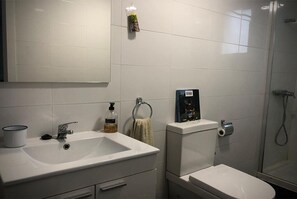 Shower, hair dryer, towels, soap